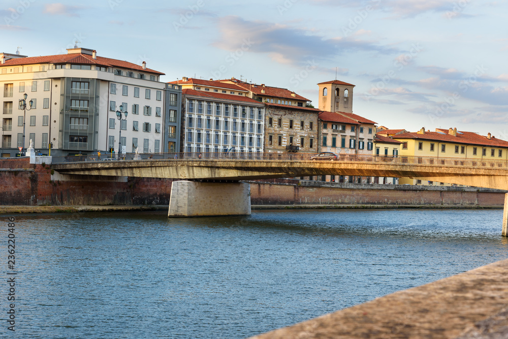View on embankment of Arno river and Solferino bridge. Pisa, Italy