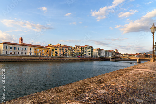 View on embankment of Arno river and Solferino bridge. Pisa, Italy © Elena Odareeva