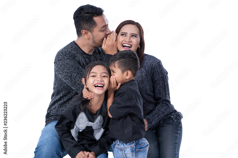 kid whispering something to parents kid whispering something to parents