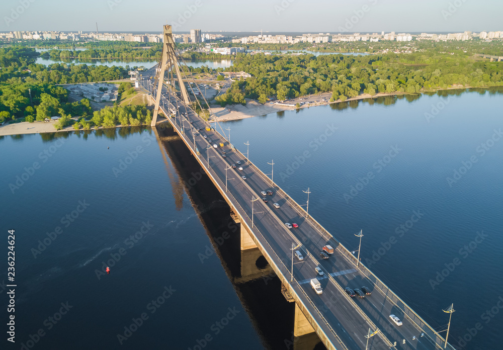 Aerial top view of Dnieper river and Moskovskiy bridge in city of Kiev, Ukraine
