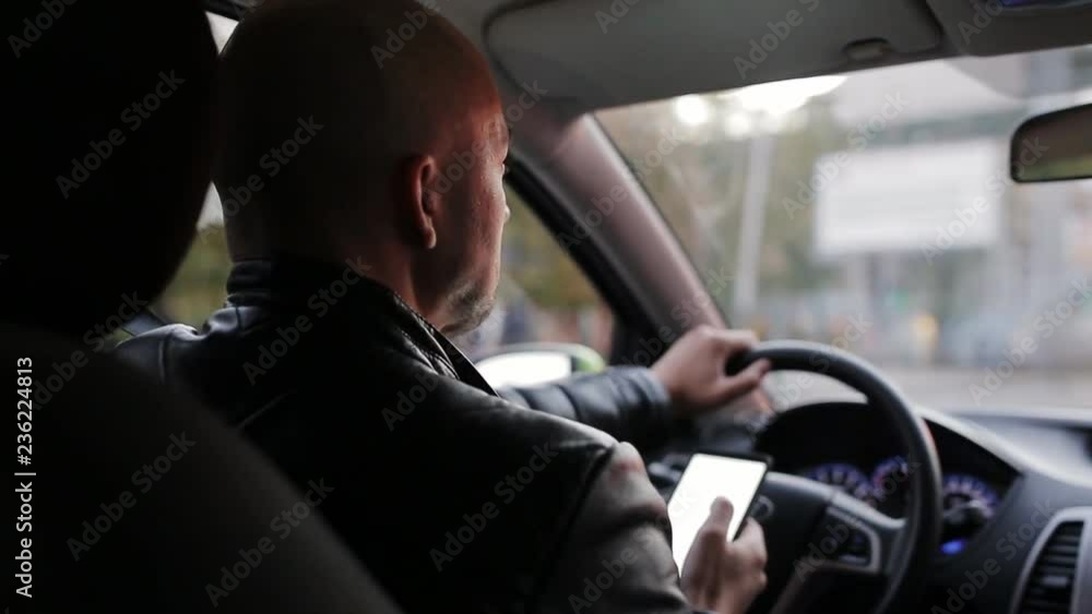 A man rides through the city using the Navigator in your smartphone. A man rides through the city using the Navigator in your smartphone.
