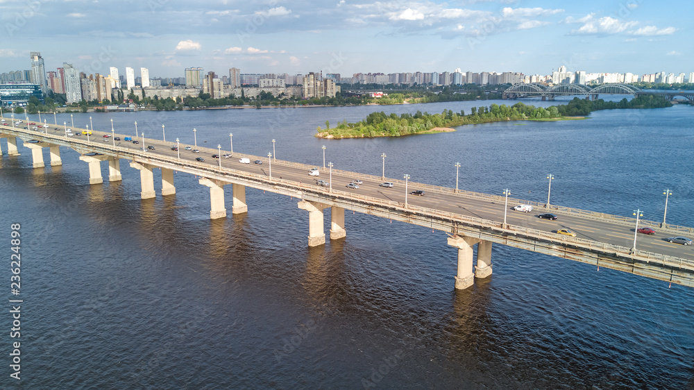 Aerial top view of Paton bridge and Dnieper river from above, city of Kiev, Kyiv cityscape skyline, Ukraine

