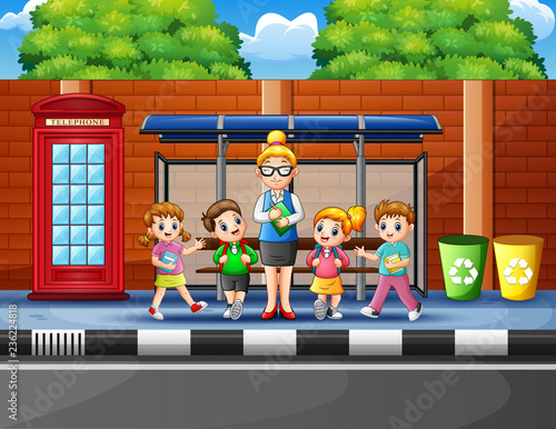Cartoon of school children in the bus stop with a teacher