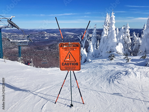 Caution sign and warning on a ski resort