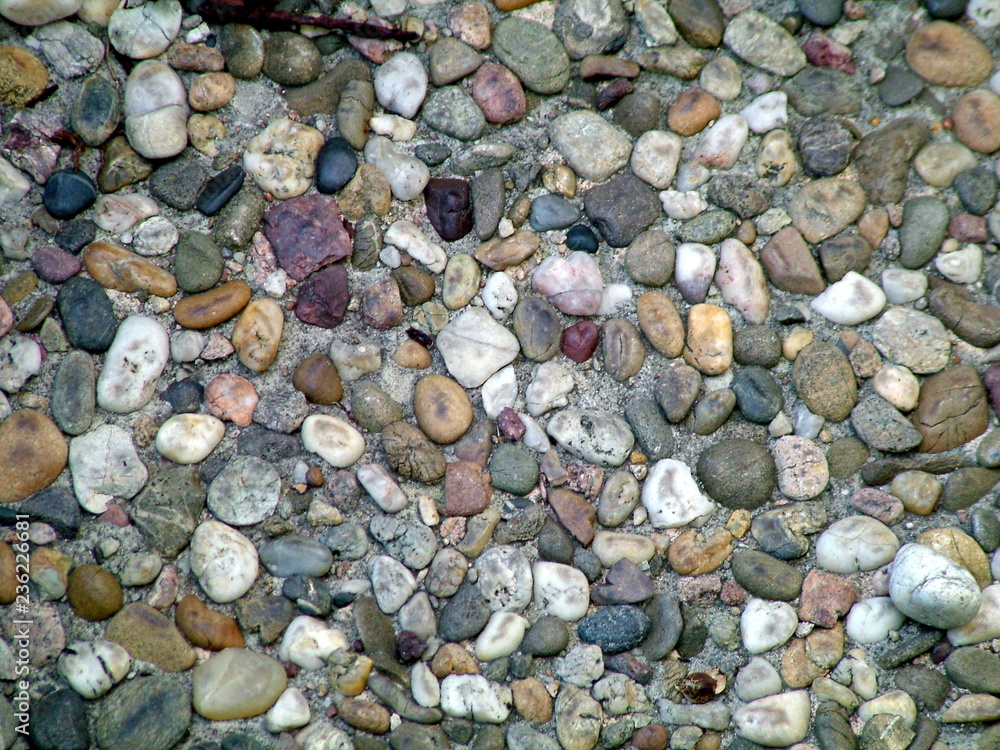colored pebbles in sand colored pebbles in sand