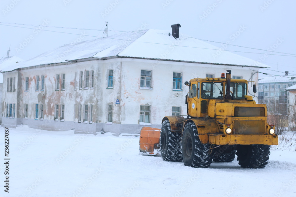 tractor removes snow. snowblower grader clears snow covered tractor removes snow. snowblower grader clears snow covered