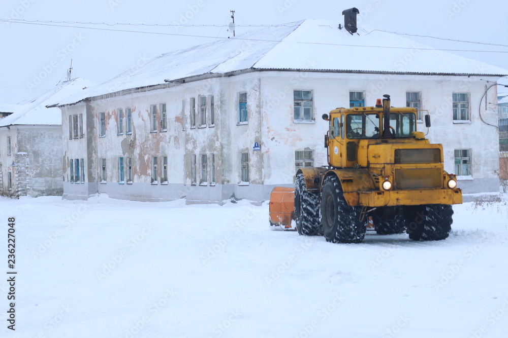 snowplow clearing roads of snow. tractor remove snow from city snowplow clearing roads of snow. tractor remove snow from city