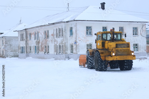 snowplow clearing roads of snow. tractor remove snow from city