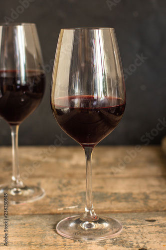 wine, red wine, transparent glass on a wooden table, a gift. Top view. copy space