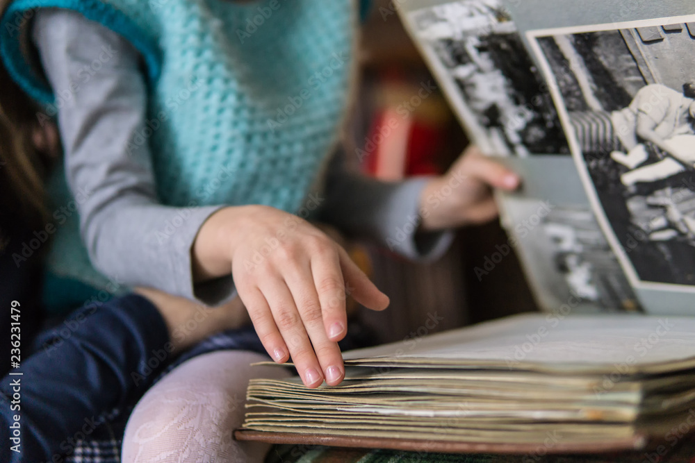 little girl leafing through a family album little girl leafing through a family album