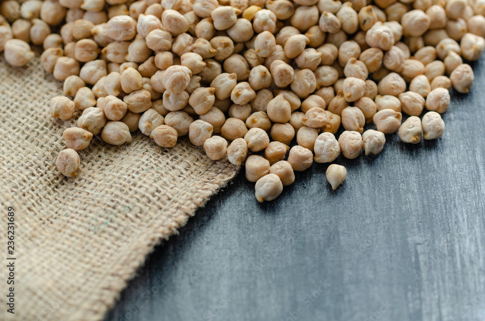 Chickpeas are on the wooden background