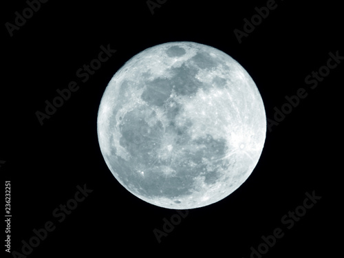 Full moon / The Moon is an astronomical body that orbits planet Earth and is Earth's only permanent natural satellite. It is the fifth-largest natural satellite in the Solar System
