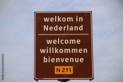 sign on the border in 4 languages to welcome travelers in the Netherlands at the ferry of Hoek van Holland
