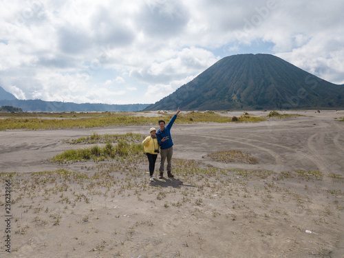Lover couple are traveling to volcano at Mt.Bromo  Gunung Bromo  Kingkong hill East Java  Indonesia