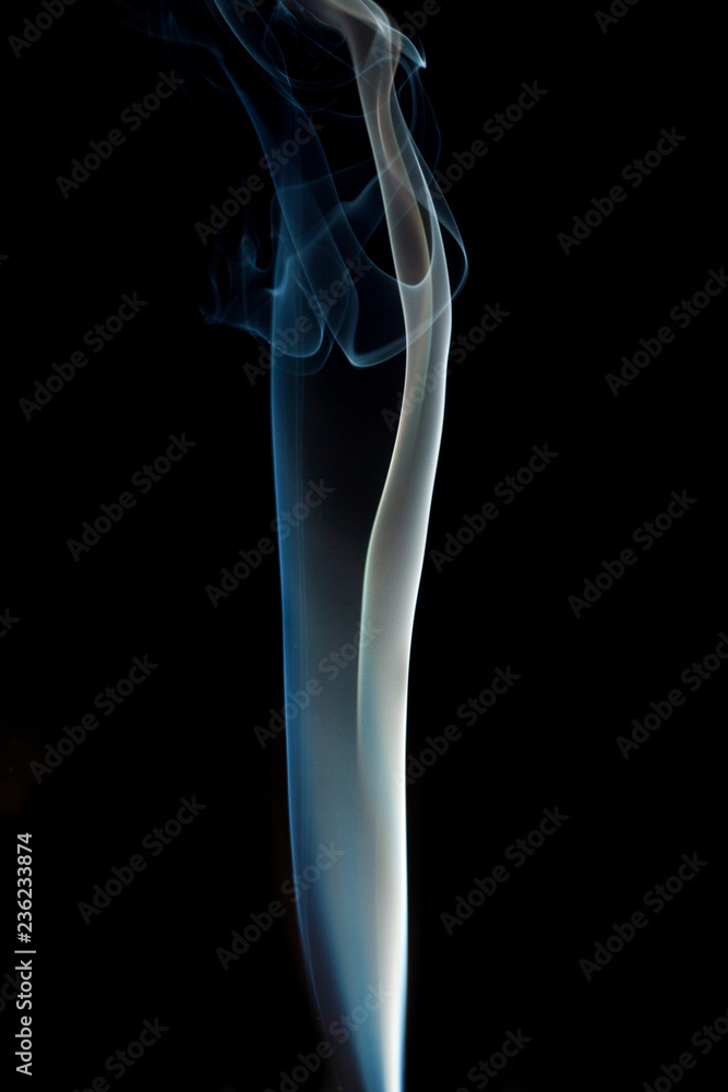 Obraz premium Blue smoke isolated on black background