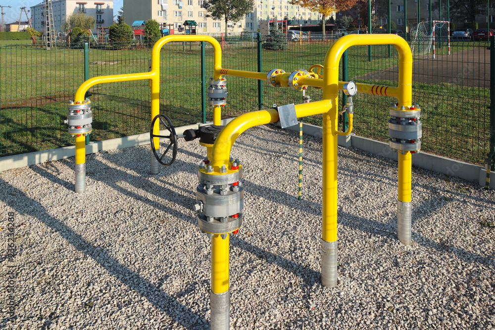 Element gas line high and medium pressure. Yellow transport pipes on the surface of the fence. Regulatory supply system for natural compressed fuel. Access overlap valves and pressure sensors. Element gas line high and medium pressure. Yellow transport pipes on the surface of the fence. Regulatory supply system for natural compressed fuel. Access overlap valves and pressure sensors.