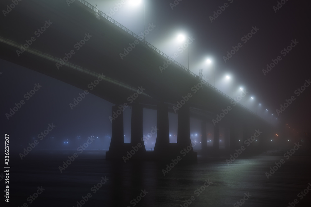 Bridge in the fog or mist by night Bridge in the fog or mist by night