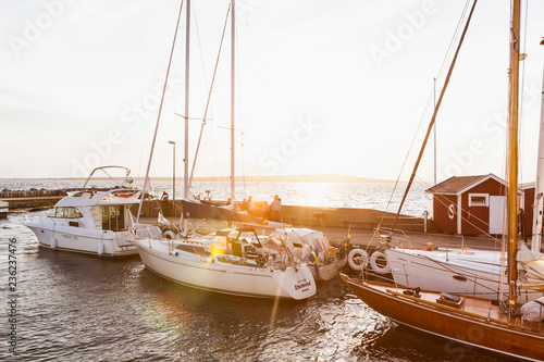 Boats at sunset at the Hano harbor in Sweden photo