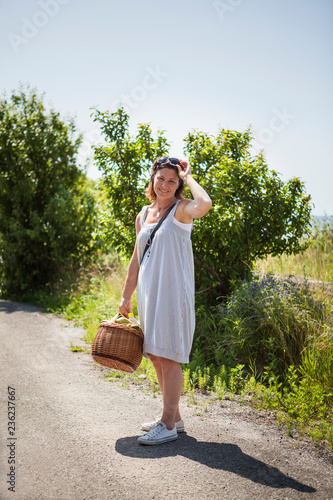 Woman with picnic basket in Blekinge, Sweden photo