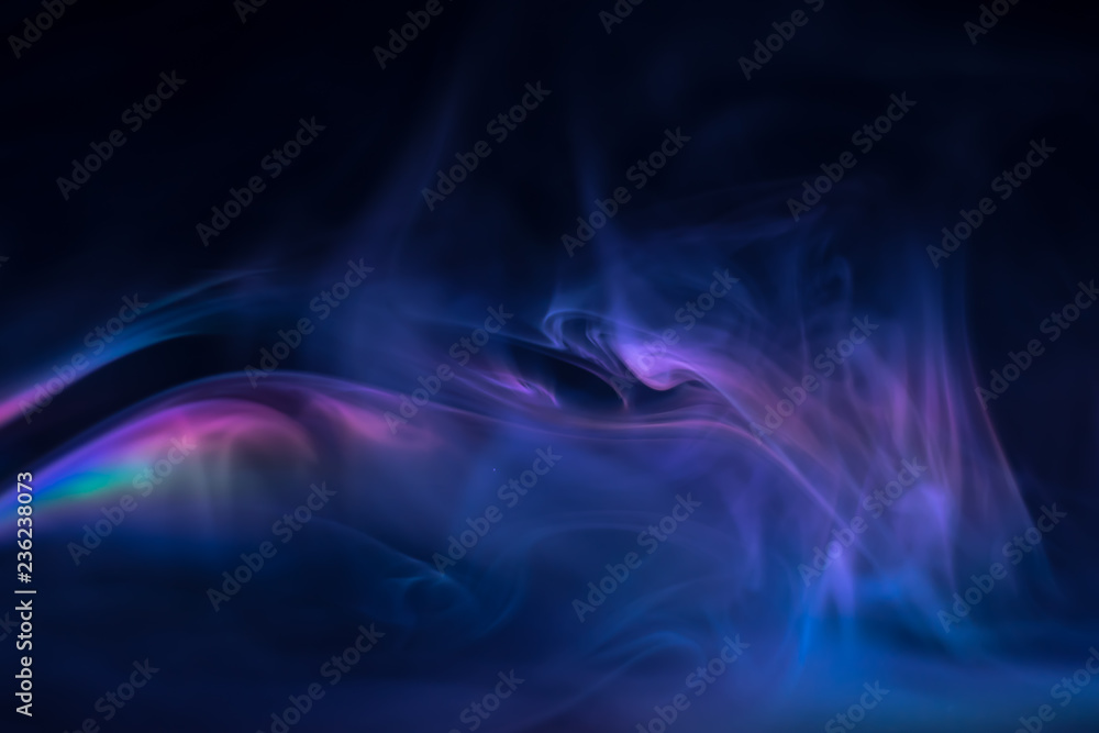 purple, blue, pink smoke (evaporation) on a black background