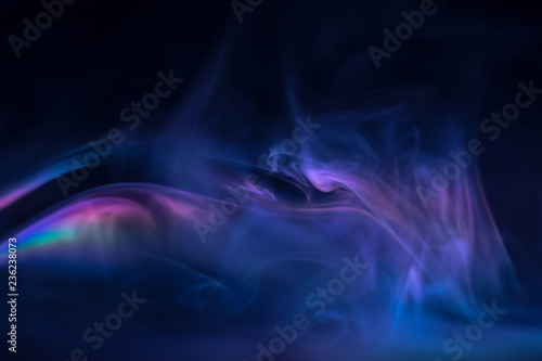 purple, blue, pink smoke (evaporation) on a black background