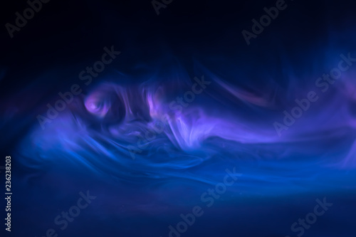 purple, blue, pink smoke (evaporation) on a black background