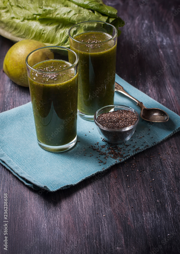 green smoothie with fruits and vegetables on black background. S green smoothie with fruits and vegetables on black background. S