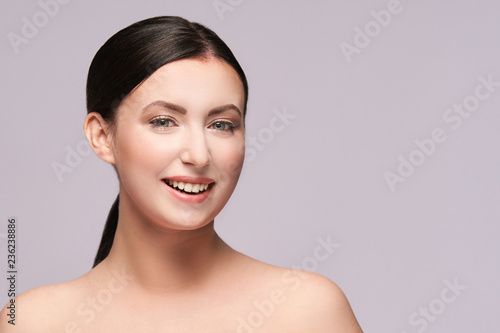 Obraz na plátně Cosmetology young woman face. White beautiful girl