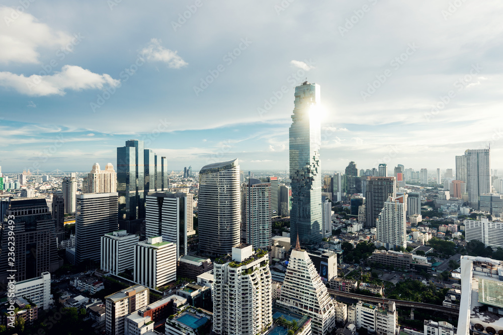 Fototapeta premium Modern building in Bangkok business district at Bangkok city with skyline at evening, Thailand.