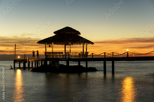 Wooden pier between sunset in Phuket, Thailand. Summer, Travel, Vacation and Holiday concept.