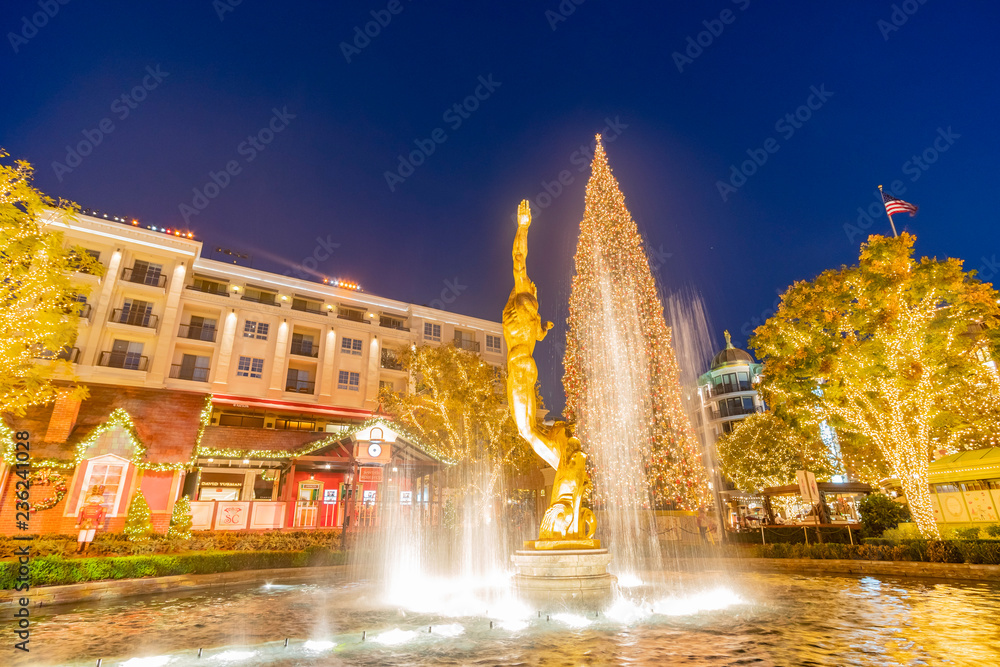 Night view of the fountain and the public art Spirit with christmas tree of American Youth in The Americana at Brand