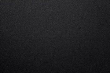 Sheet of black paper texture background