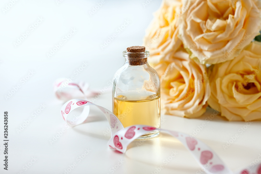 Glass jar with rose water and aromatherapy, copy space for text. Glass jar with rose water and aromatherapy, copy space for text.