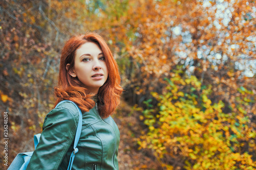 Young woman with autumn tree.