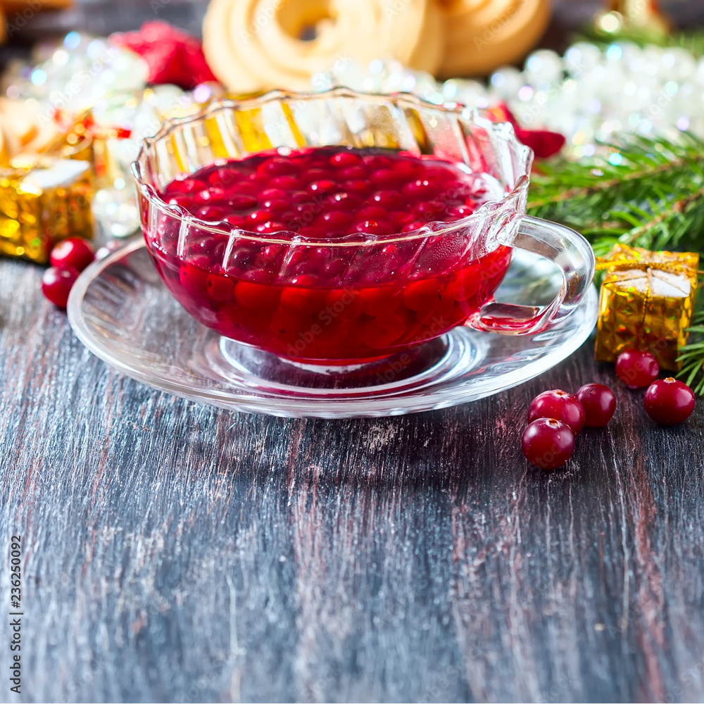 Christmas hot cranberry tea, cookies and orange slices, on dark background. Christmas hot cranberry tea, cookies and orange slices, on dark background.