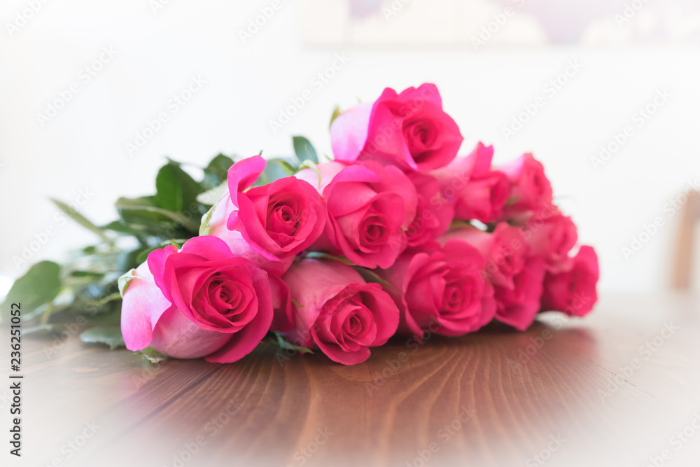 Pink Roses on a Wooden surface. Rose blooms. Pink Roses on a Wooden surface. Rose blooms.