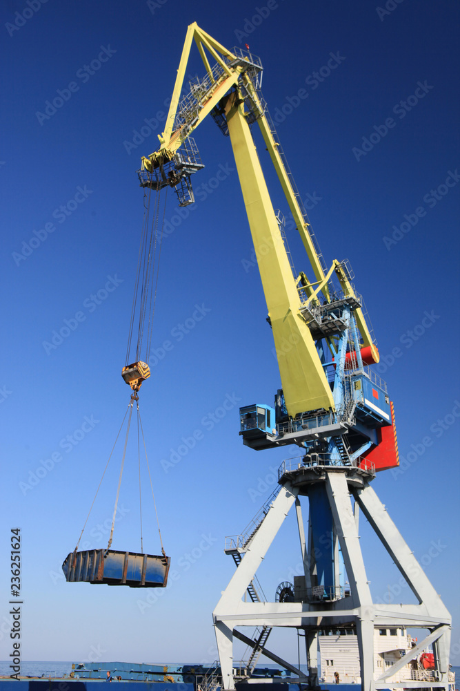 Gantry crane in seaport during loading Gantry crane in seaport during loading