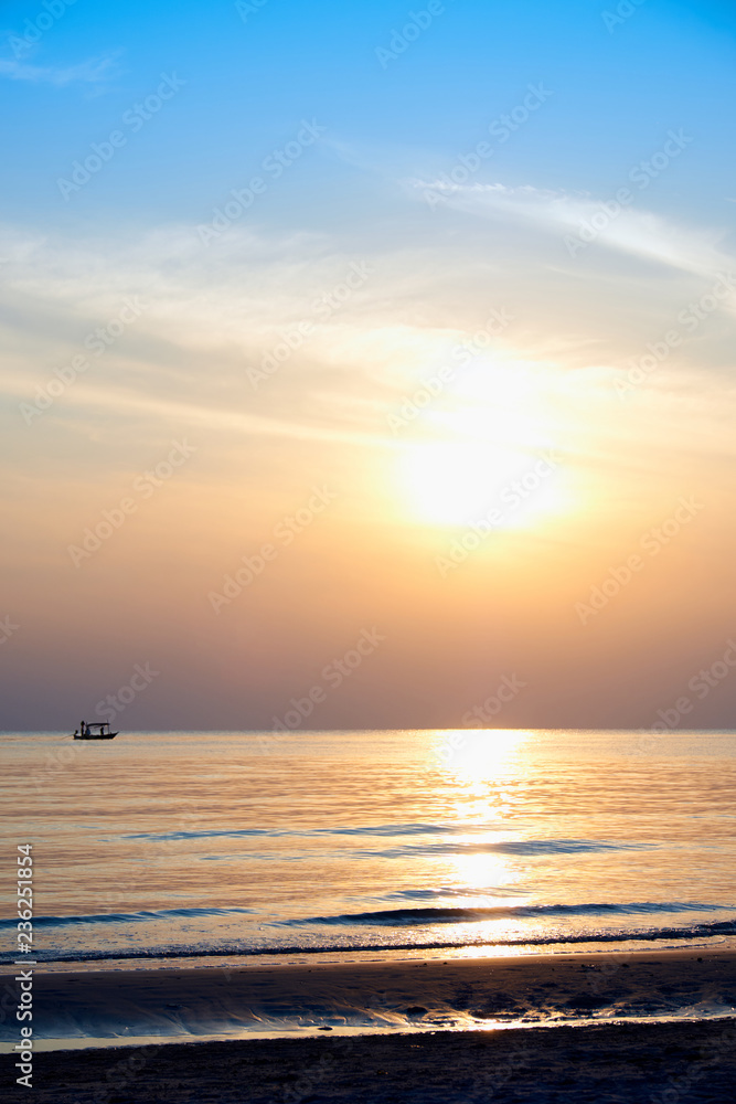 Photo of seascape in the morning. Fishermen are going out to fish.