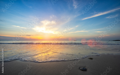 Beautiful beach with soft wave of the sea on the sandy beach. Beautiful sunrise in early morning at the Samed Island in Thailand.