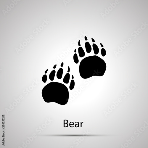 Bear paws, steps imprints, simple black silhouette on gray