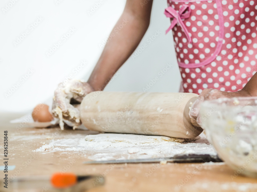 Girl hands rolling dough for making bread or pizza, lifestyle concept. Girl hands rolling dough for making bread or pizza, lifestyle concept.