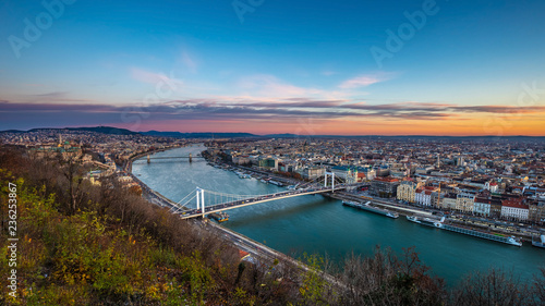 Budapest, Hungary - Aerial panoramic skyline of Budapest at sunrise with Elisabeth Bridge (Erzsebet Hid), Szechenyi Chain Bridge, Parliament and cruise ships on River Danube