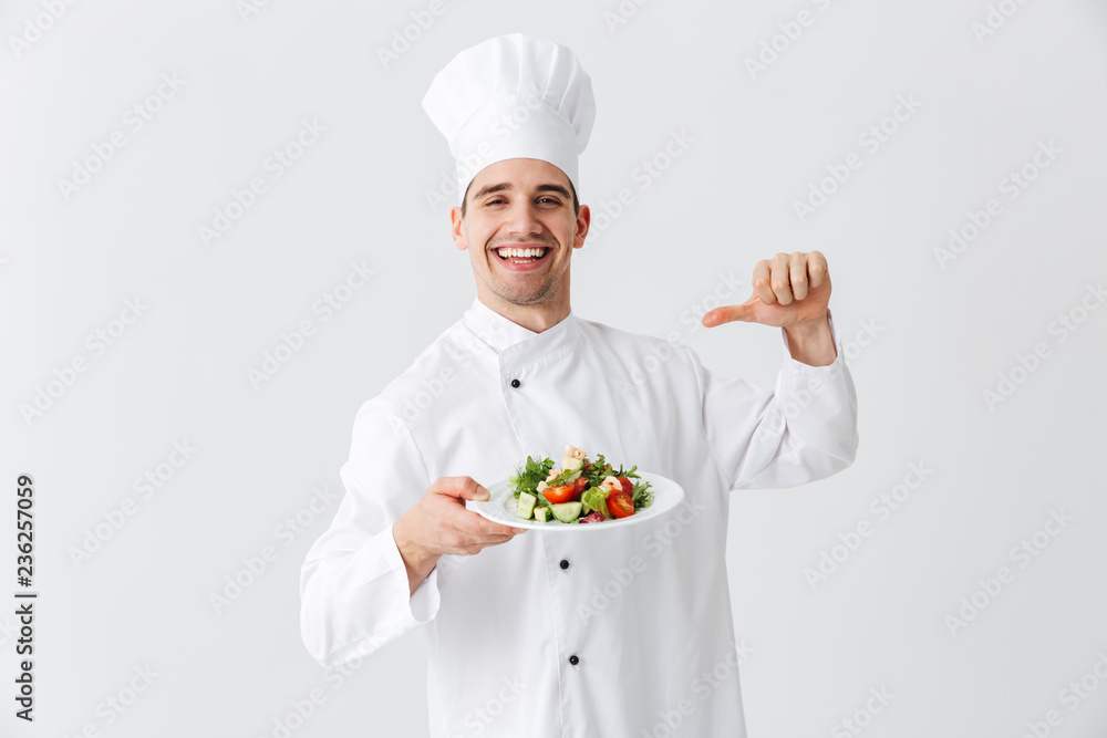 Excited man chef cook wearing uniform Excited man chef cook wearing uniform