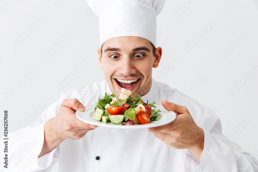Excited man chef cook wearing uniform Excited man chef cook wearing uniform
