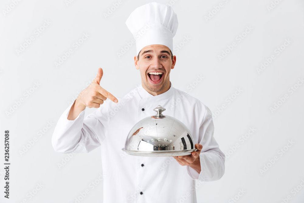 Excited man chef cook wearing uniform Excited man chef cook wearing uniform