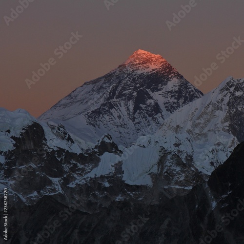 Last sunlight of the day illuminating the peak of Mount Everest. View from Gokyo Ri, Nepal. © u.perreten