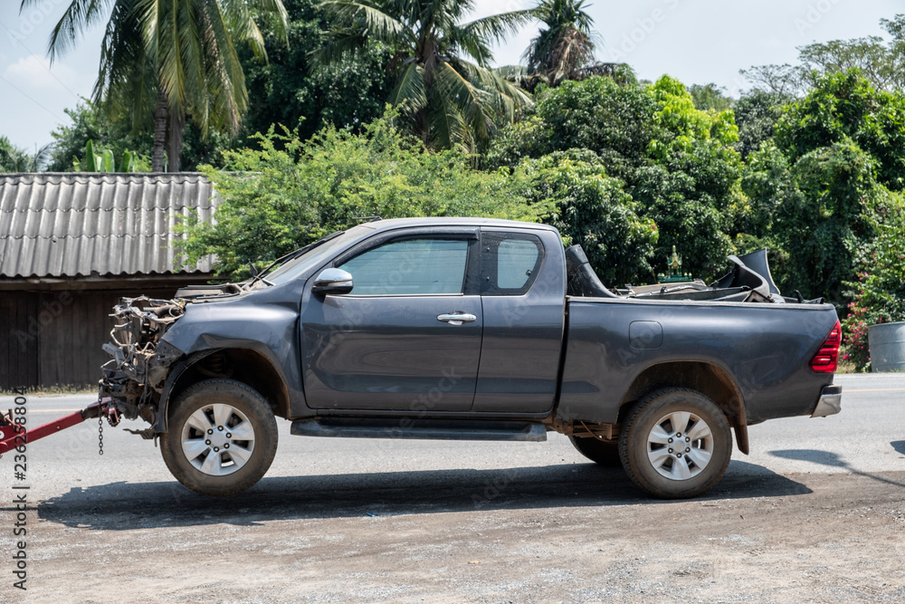Crashed accident pickup car with towing on road Crashed accident pickup car with towing on road
