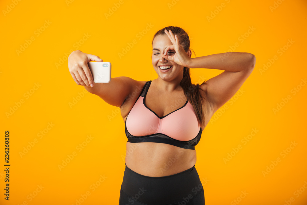 Portrait of a cheerful overweight fitness woman Portrait of a cheerful overweight fitness woman