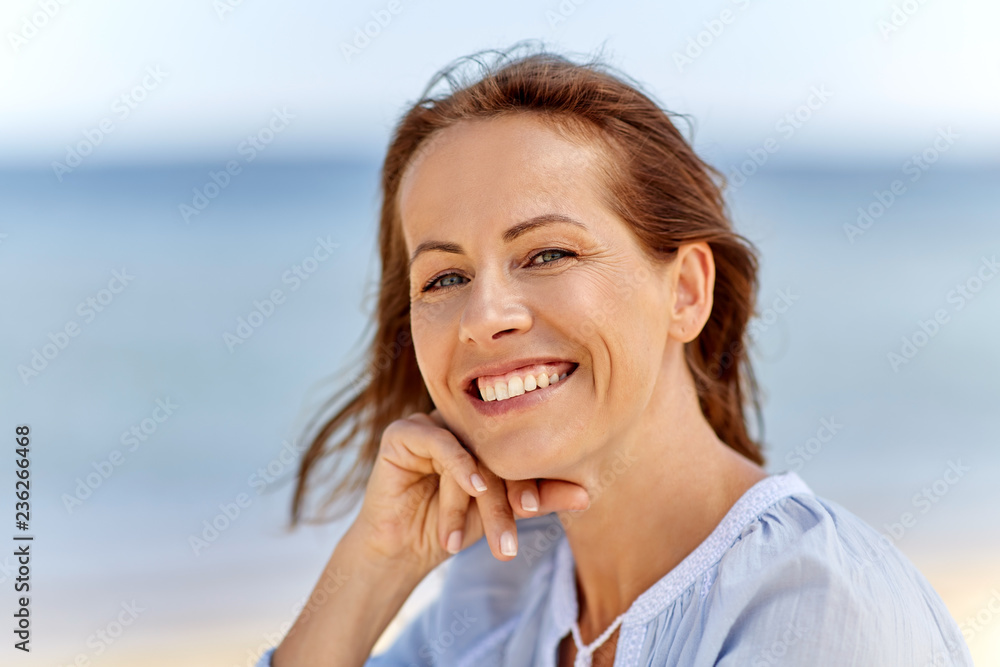 people and leisure concept - portrait of happy smiling woman on summer beach people and leisure concept - portrait of happy smiling woman on summer beach