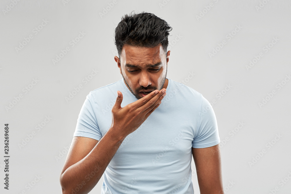 health problem and people concept - unhealthy indian man coughing over grey background - obrazy, fototapety, plakaty 